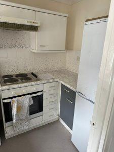 Property for sale by Auction A kitchen with white cabinets and a stove, located on Rosefield Road as part of 13 Maynard Court. Presented by Palace Auctions