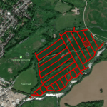 Property for sale A satellite map showing green fields and a golf course. Red lines overlay a large rectangular area, dividing this property for sale into smaller sections. Roads and buildings appear on the left and a brown field on the lower right. Presented by Palace Auctions. Presented by Palace Auctions