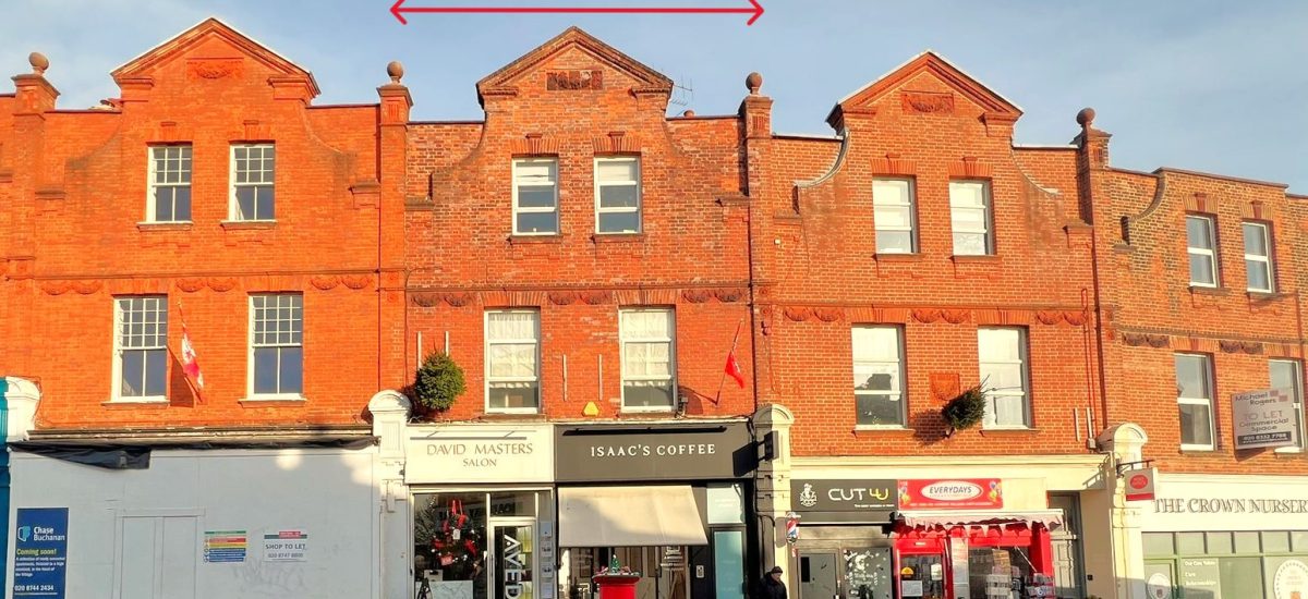 A row of red-brick buildings at 120 St. Margaret's Road, TW1 2AA, featuring store signs like "David Masters Salon," "Isaac's Coffee," "Cut-U," and "The Crown Nutrition." Available for sale by auction with Palace Auctions, London, this mixed commercial and residential investment boasts decorative brickwork and dormer windows. A few people are seen walking