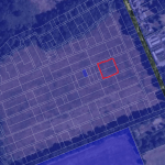 A satellite map image with outlined property lines. Within the parcels of premodernity agricultural land at Long Reach Ockham, a notable red square boundary highlights a specific plot. Roads or paths run vertically and horizontally, surrounded by fields and vegetation. Available for sale by auction with Palace Auctions.