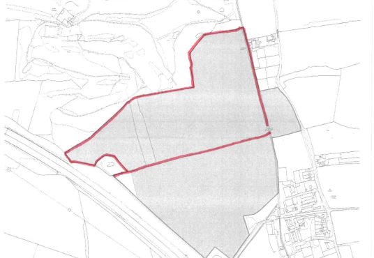 A map showing an outlined area in red with a grey shaded region within it, titled "Epping Plan Lot 1." The land appears to be a mix of open fields and developed areas, intersected by roads. This block of agricultural land holds significant hope value for future planning consent and is available for sale by Auction with Palace Auctions.