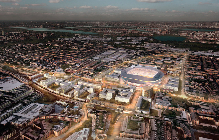 Aerial view of Tottenham an urban area with a large illuminated stadium at twilight illistrating property for sale.