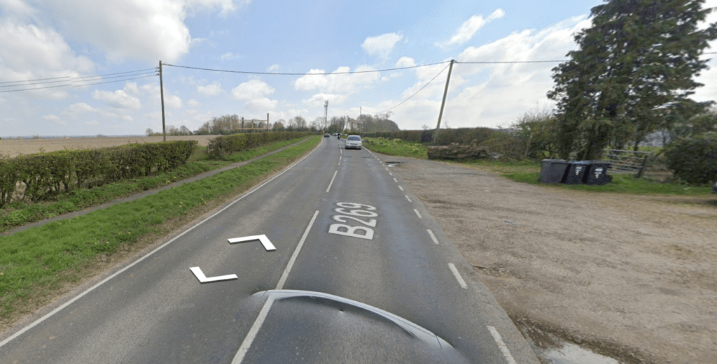 Rural road B6200 with open fields, indicating access to land at Beech Farm for sale by auction