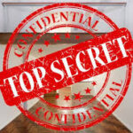 Top secret property for sale. Top Secret stamp on a blurred document
