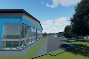 A modern industrial park with large blue and grey buildings featuring glass windows is for sale with Palace Auctions. The structures are surrounded by trees and green spaces. The sky is blue with a few clouds, and a paved road runs between the buildings.