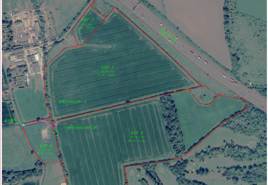 Property for sale by Auction Aerial view of a large, segmented farmland adjacent to a major highway. The 2.57 acres offer future commercial or self build opportunities, divided into lots labeled 1, 2, 3, and 4 with green text and red boundary lines. Surrounding areas include buildings, roads, and natural landscape features. Presented by Palace Auctions