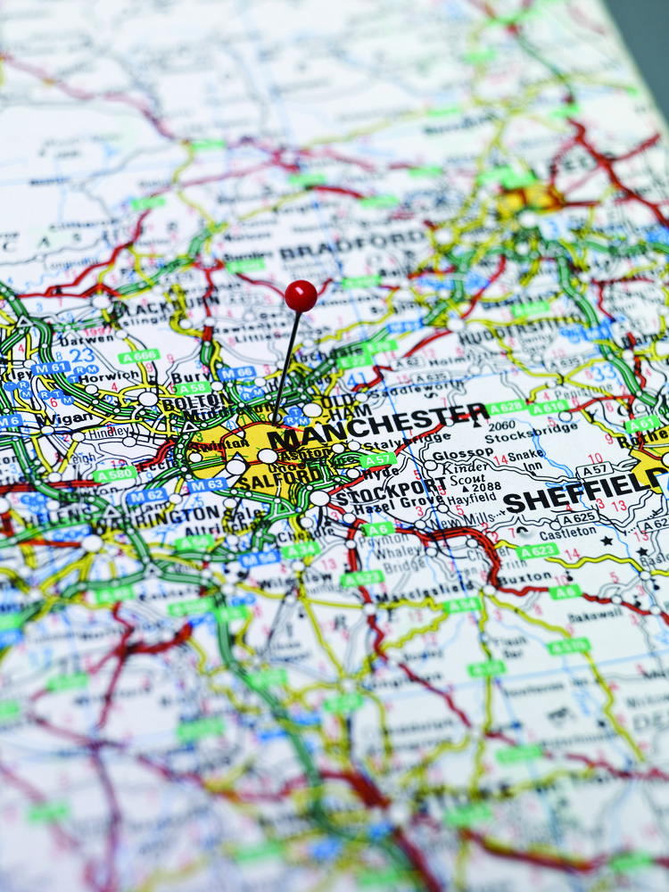 Property for sale by Auction A detailed map of part of England with a red pin marking the city of Manchester. Surrounding cities like Bradford, Huddersfield, and Sheffield are also visible. Various roads, highways, towns, and geographic features are intricately depicted. Presented by Palace Auctions