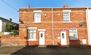 Property for sale by Auction A row of connected two-story brick houses with white-framed windows and doors. Each house has a small rectangular window on the upper floor and a larger window on the lower floor. A street sign reads "Edgeware Street. Presented by Palace Auctions