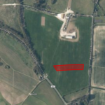 Property for sale by Auction Aerial view of a rural landscape with fields and roads. A highlighted parcel of land at the center offers excellent farm access, ideal for investment. Surrounding areas feature lush greenery, additional fields, and intersecting roads labeled Limpsfield Rd, Broom Bank, and Beech Farm Rd. Presented by Palace Auctions