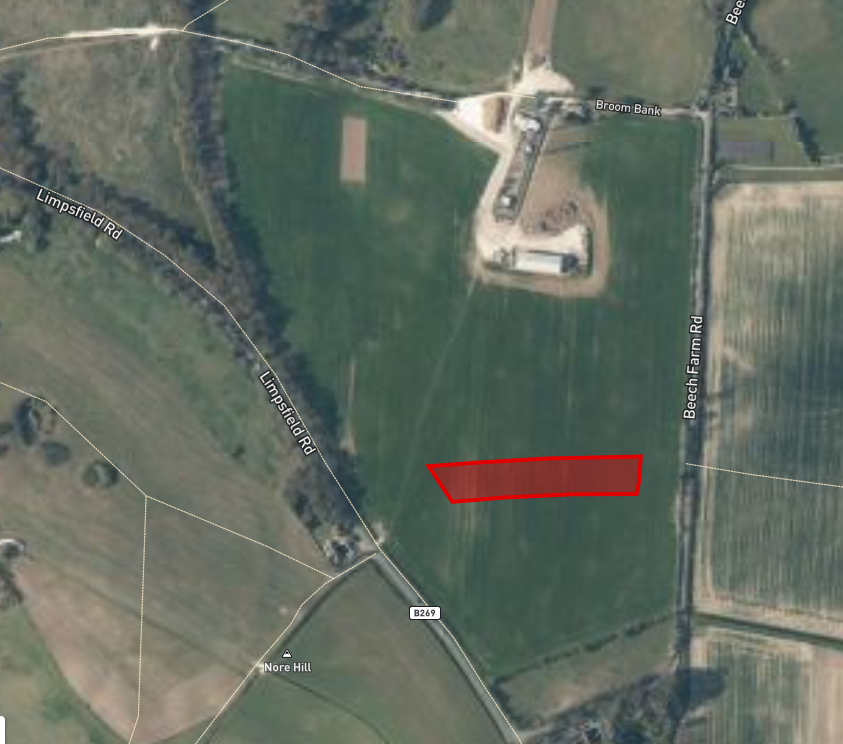 Property for sale by Auction Aerial view of a rural landscape with fields and roads. A highlighted parcel of land at the center offers excellent farm access, ideal for investment. Surrounding areas feature lush greenery, additional fields, and intersecting roads labeled Limpsfield Rd, Broom Bank, and Beech Farm Rd. Presented by Palace Auctions