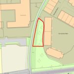 Property for sale A map showing a triangular plot of land outlined in red, situated between buildings and a curved road. The area, ideal for development land Crawley seekers, includes some trees and is near a car auction mart and other labeled structures. Presented by Palace Auctions