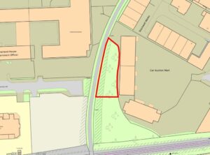 Property for sale A map showing a triangular plot of land outlined in red, situated between buildings and a curved road. The area, ideal for development land Crawley seekers, includes some trees and is near a car auction mart and other labeled structures. Presented by Palace Auctions