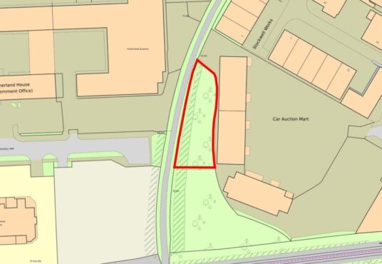 Property for sale A map showing a triangular plot of land outlined in red, situated between buildings and a curved road. The area, ideal for development land Crawley seekers, includes some trees and is near a car auction mart and other labeled structures. Presented by Palace Auctions