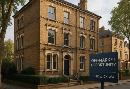 Property for sale A large, three-story Victorian-style brick house stands on a quiet street. A sign reads "Off-Market Opportunity, Chiswick W4 Block." Surrounded by trees, it also offers an exciting garage conversion project potential. Presented by Palace Auctions