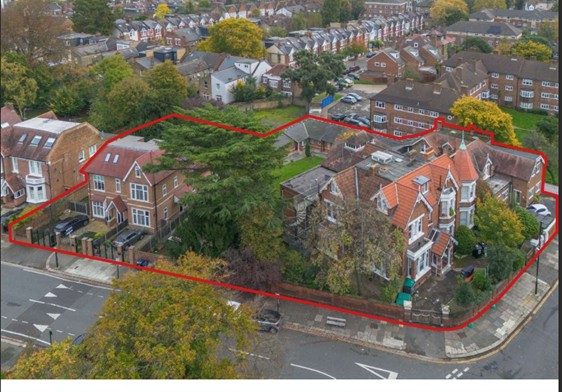 Property for sale Aerial view of a property with multiple houses and trees, outlined in red, at the corner of Creswick Road and Acton in a suburban neighborhood, with rows of houses and greenery visible in the background. Presented by Palace Auctions