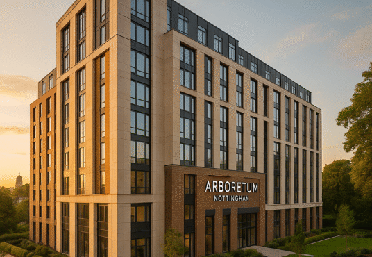 Property for sale A modern, multi-story building with large windows and a sign reading “ARBORETUM NOTTINGHAM,” this student block investment is surrounded by landscaped greenery under a clear sky at sunset. Presented by Palace Auctions