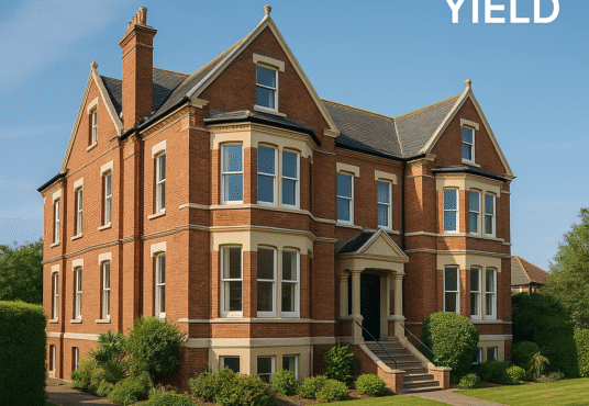 Property for sale A large, elegant brick house with manicured hedges and lawn, ideal as a Clacton licensed hostel investment. Text in the top right corner reads “14.98% YIELD.” The sky is clear and blue. Presented by Palace Auctions