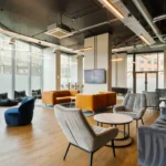 Property for sale Modern lounge area with large windows, stylish chairs, sofas, wood flooring, and contemporary lighting. Located in Langford Tower Sheffield, this bright and inviting space is perfect for those seeking modern flats in Sheffield. Presented by Palace Auctions