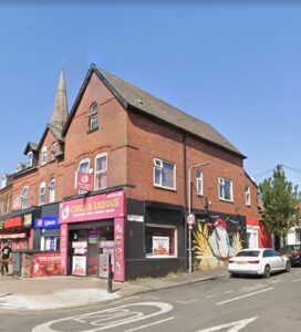 Property for sale A red-brick corner building with shops on the ground floor, including "Chic A Licious" with a bright pink sign, sits on Stockport Road Levenshulme. A mural of a woman's face decorates the side wall, making it an appealing Levenshulme investment property. Presented by Palace Auctions