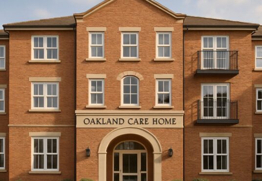 Property for sale A modern three-story brick building with white-framed windows and an arched entrance, "Oakland Care Home" offers a prime investment property Manchester opportunity, surrounded by shrubs and set against a clear sky. Presented by Palace Auctions
