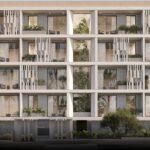Property for sale A modern four-story mixed-use apartment building in Paphos Centre, featuring large balconies, glass railings, and lush greenery. Trees and plants enhance the exterior, while cars and a pedestrian can be seen in front of the building. Presented by Palace Auctions
