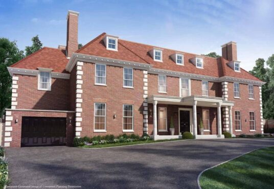 Property for sale A large, two-story brick house with white trim, multiple chimneys, and a red tile roof—an exceptional Hampstead Garden Suburb luxury home surrounded by trees and blue sky—offers elegant living in the heart of London. Presented by Palace Auctions