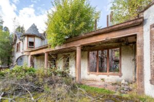Property for sale An abandoned, overgrown house with broken windows and crumbling walls hints at the potential for a Scottish manor house development, its weathered columns and wild vegetation awaiting a visionary transformation. Presented by Palace Auctions