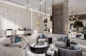Property for sale Modern, luxurious lobby at LIV LUX with contemporary furniture, round coffee tables, plush chairs, and pendant globe lights. Neutral tones and gold accents create a sophisticated atmosphere inspired by the elegance of Dubai Marina. Presented by Palace Auctions
