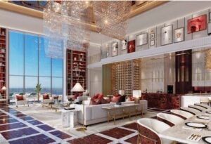 Property for sale A luxurious, spacious living area with high ceilings, large windows, elegant chandeliers, modern art on the walls, and designer furnishings—perfect for an exclusive Luxury Dubai Property Auction experience. Presented by Palace Auctions