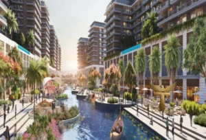 Property for sale A modern waterfront development, DAMAC Riverside Views features tall buildings, palm trees, and outdoor seating. People stroll along the canal with gondolas, surrounded by greenery and flowers under a bright sky—ideal for a stylish waterfront flat lifestyle. Presented by Palace Auctions