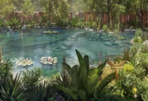 Property for sale A lush, tropical garden surrounds a clear, tranquil pond with floating lilies at DAMAC Riverside Views. Dense greenery and various plants frame the water, creating a serene oasis near Dubai Investment Park 2. Presented by Palace Auctions