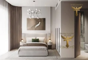 Property for sale Modern bedroom in a luxury flat with a large bed, neutral tones, two bedside tables and lamps, abstract wall art above the bed, floor-to-ceiling curtains, modern ceiling light, and "Transparency Real Estate" logos on the walls in Jumeirah Village Triangle. Presented by Palace Auctions
