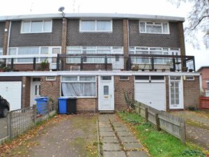 Property for sale A three-storey brick townhouse with a white front door, large windows, balcony, and driveway bins—an ideal HMO investment property Derby for sale, featuring a small fenced garden with path and grass in a prime location. Presented by Palace Auctions