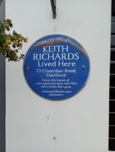 Property for sale A blue English Heritage plaque on a white wall reads: "KEITH RICHARDS Lived Here. 33 Chastilian Road, Dartford. Once the home of rock god and now cult film hero Keith Richards. crosseyedheart.com substan1. Presented by Palace Auctions