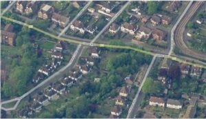 Property for sale Aerial view of a residential neighbourhood in Croydon, featuring houses, tree-lined streets, gardens, and intersecting roads. Campden Road appears prominently, with a railway line running along the right side and the area looking green and suburban. Presented by Palace Auctions