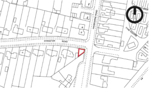 Property for sale Black and white street map highlighting a small, triangular plot outlined in red at the junction of Kynaston Road and Woodburne Road, near residential buildings—an Auction Opportunity for Corner Plot Land Didcot in Oxfordshire. Presented by Palace Auctions