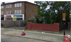 Property for sale A street view in Lambeth shows a red brick wall, traffic cones, fencing, a tree, shops in a brown building, a yellow pedestrian crossing sign, and a street sign reading "Stratton View" on the pavement near the river bank. Presented by Palace Auctions